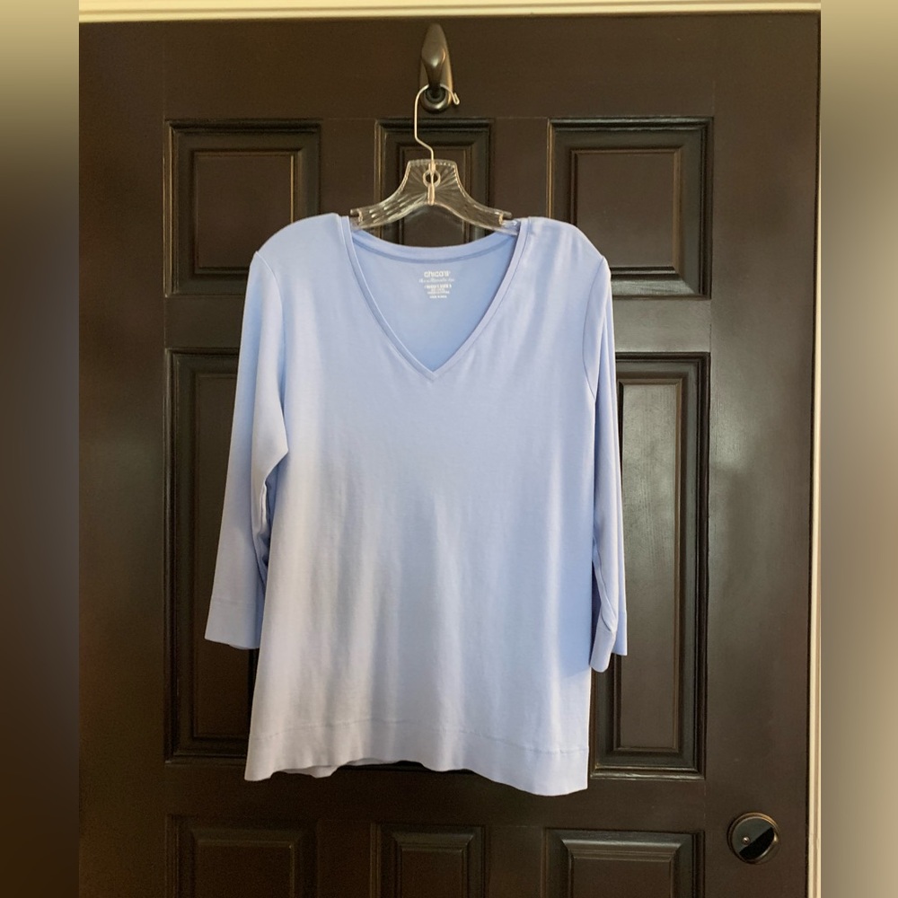Chico’s Women's Light Blue V-Neck Top size 3(XL).